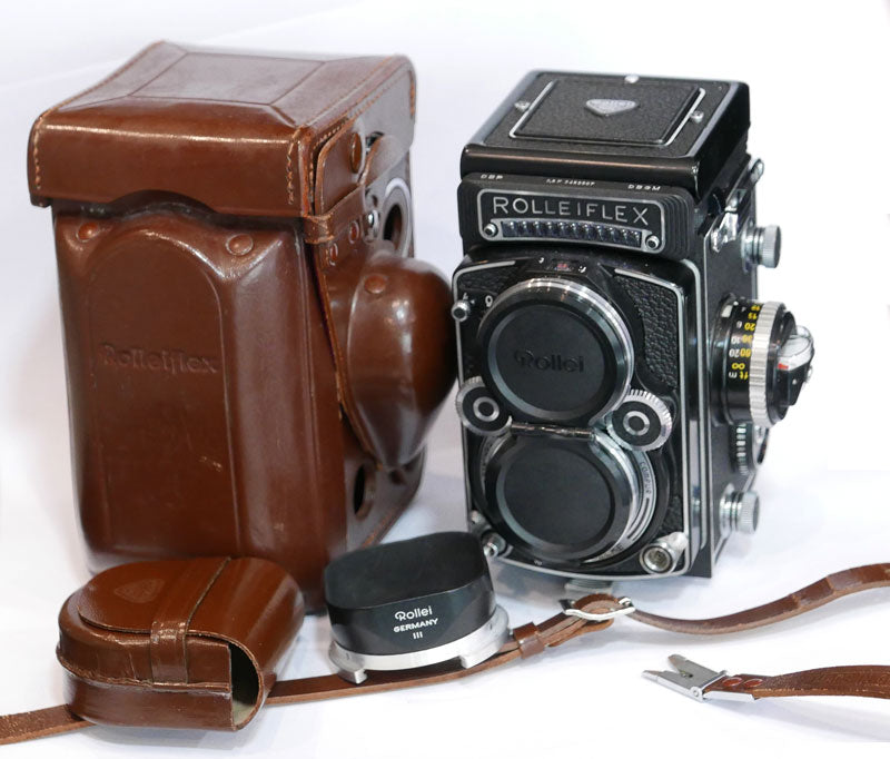 Rollei 2.8 F Planar avec cellule, étui cuir, parasoleil, bouchon