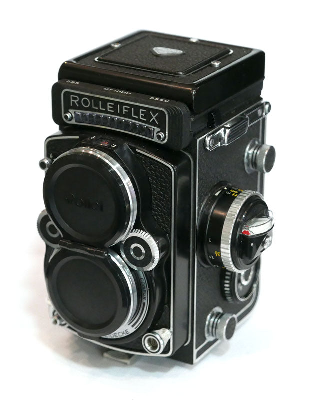 Rollei 2.8 F Planar avec cellule, étui cuir, parasoleil, bouchon
