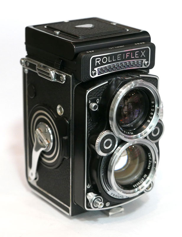 Rollei 2.8 F Planar avec cellule, étui cuir, parasoleil, bouchon
