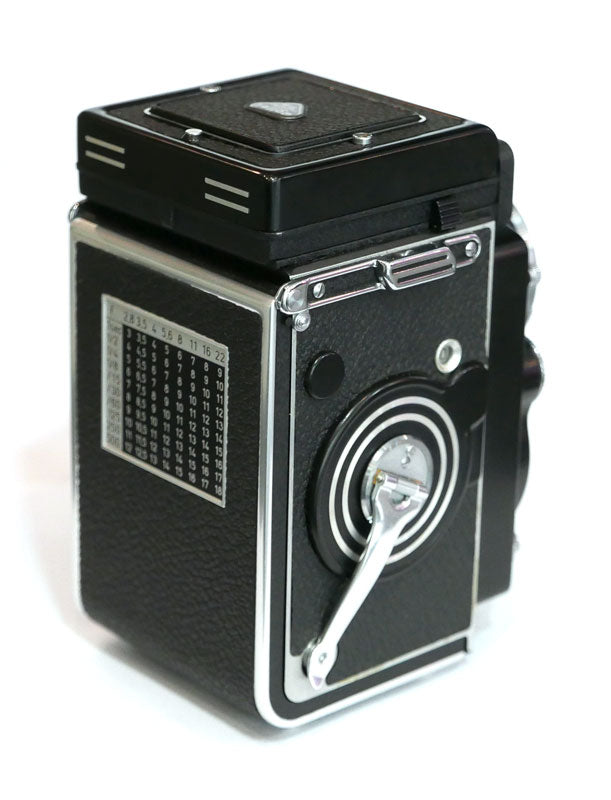 Rollei 2.8 F Planar avec cellule, étui cuir, parasoleil, bouchon