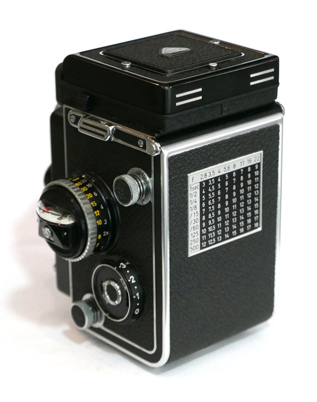 Rollei 2.8 F Planar avec cellule, étui cuir, parasoleil, bouchon