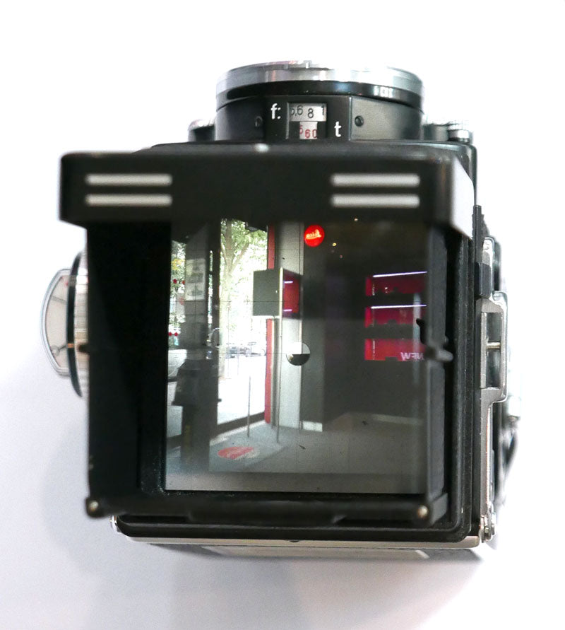 Rollei 2.8 F Planar avec cellule, étui cuir, parasoleil, bouchon